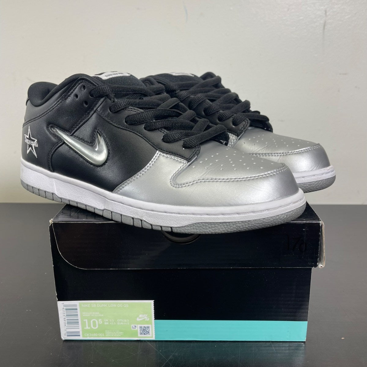 Nike SB Dunk Low Supreme Jewel Swoosh Silver 10.5 (Moderately Worn Pre-Owned)NikeMetallic Silver/Metallic Silver-Black - Image 1