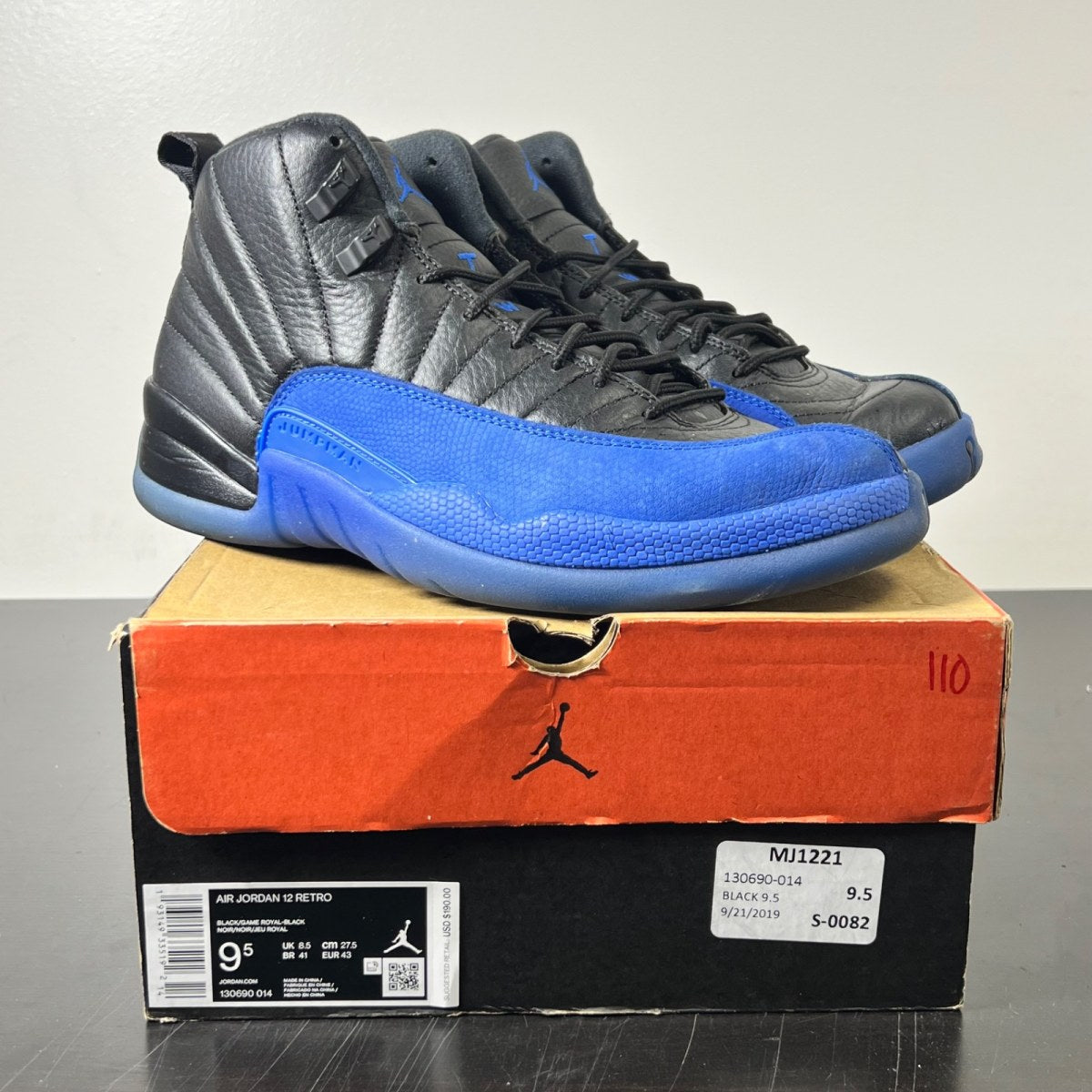 Jordan 12 Retro Black Game Royal 9.5 (Heavily Worn Pre-Owned)JordanBlack/Game Royal-Black - Image 1