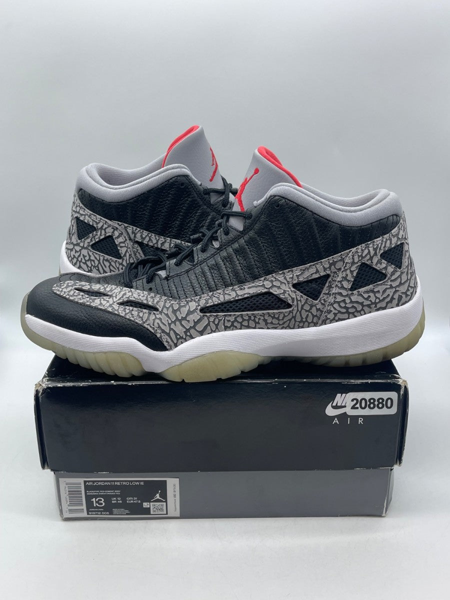 Jordan 11 Retro Low IE Black Cement 13 (Moderately Worn Pre-Owned) - Image 1
