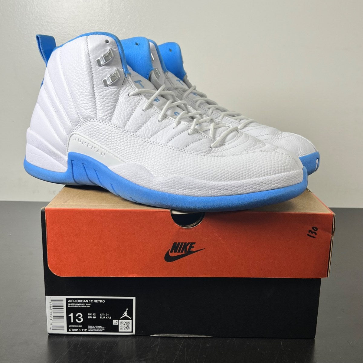 Jordan 12 Retro Melo (2025) 13 (Lightly Worn Pre-Owned)JordanWhite/University Blue/Metallic Silver - Image 1