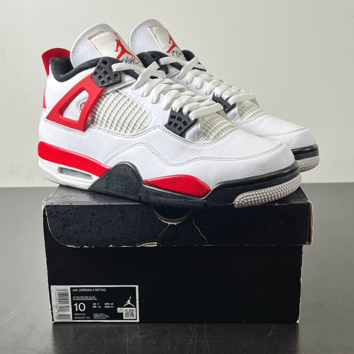 Jordan 4 Retro Red Cement 10 (Lightly Worn Pre-Owned)JordanWhite/Fire Red/Black/Neutral Grey - Image 1