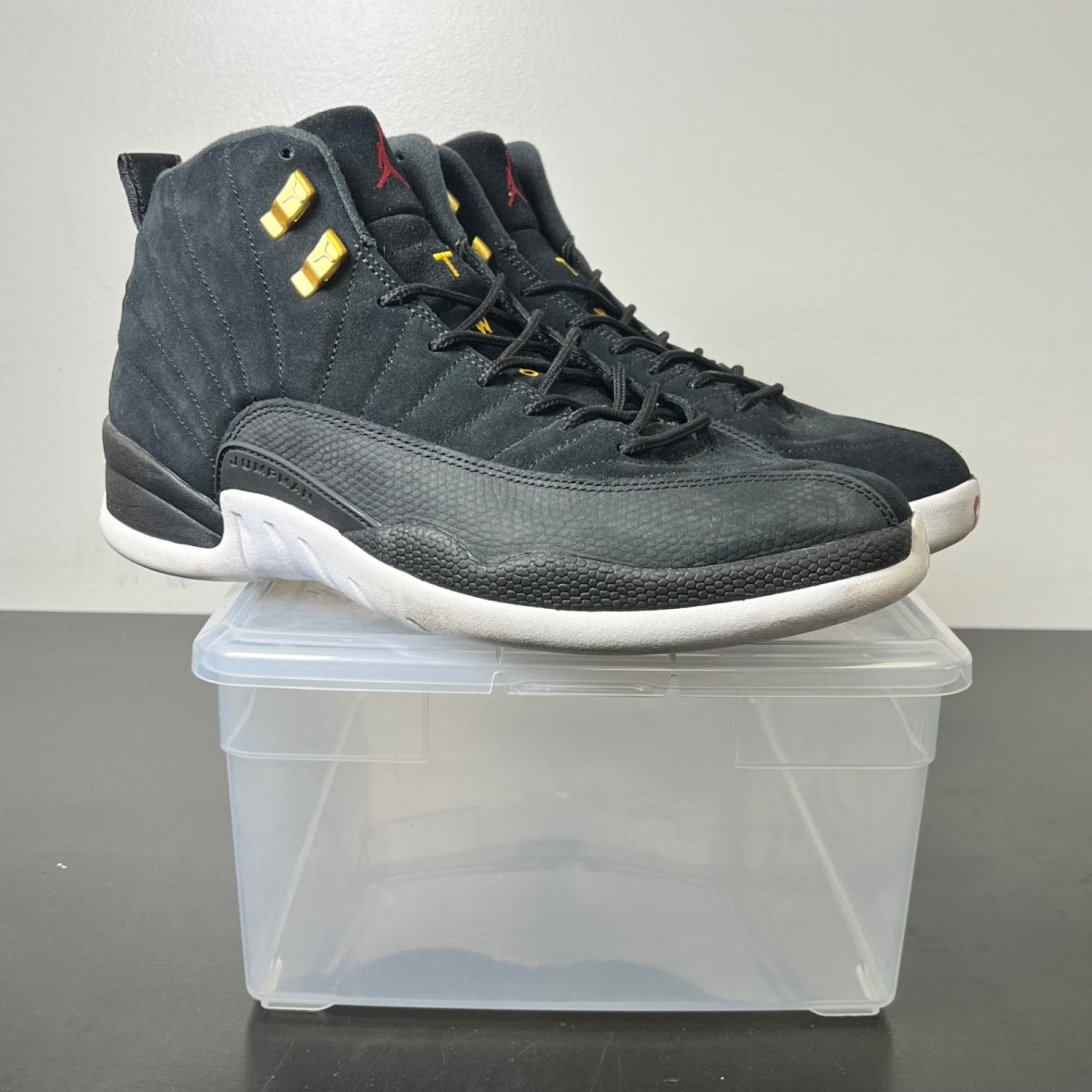 Jordan 12 Retro Reverse Taxi 11 (Moderately Worn Pre-Owned)JordanBlack/White-Taxi-Black - Image 1