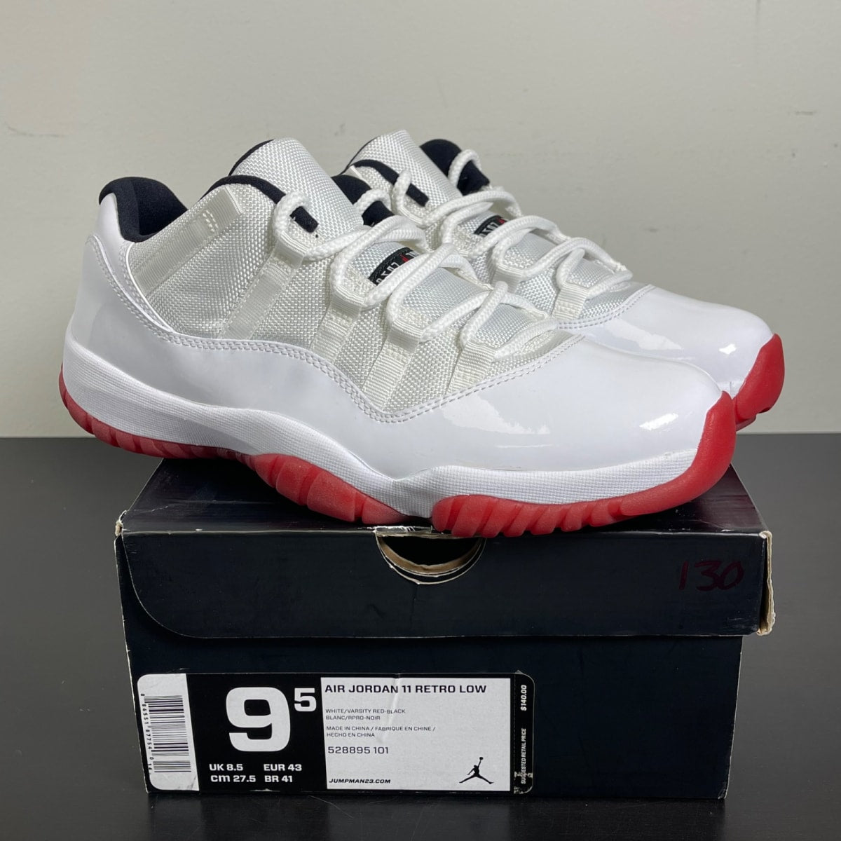 Jordan 11 Retro Low White Red (2012) 9.5 (Moderately Worn Pre-Owned)JordanWhite/Varsity Red-Black - Image 1