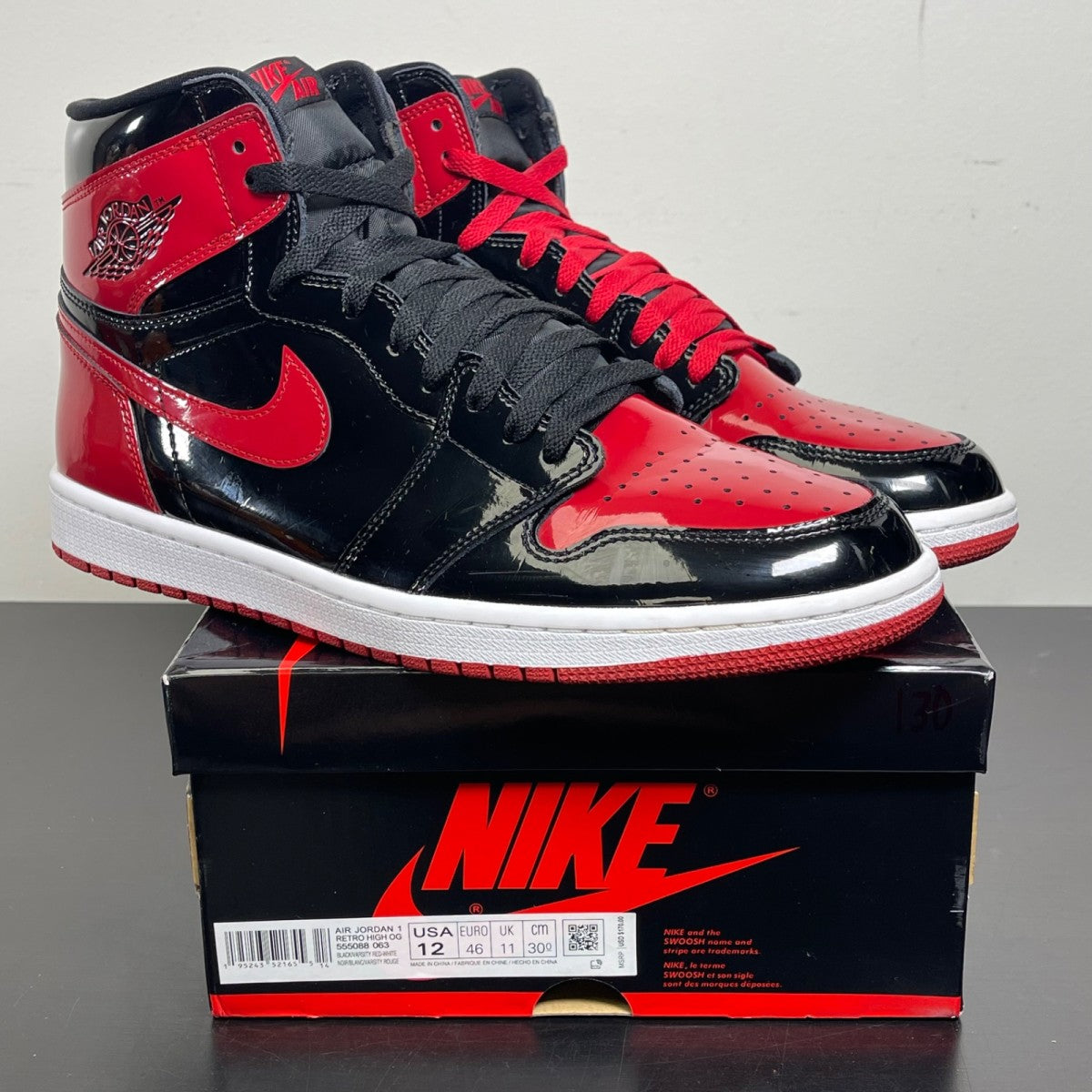 Jordan 1 Retro High OG Patent Bred 12 (Moderately Worn Pre-Owned)JordanBlack/White-Varsity Red - Image 1