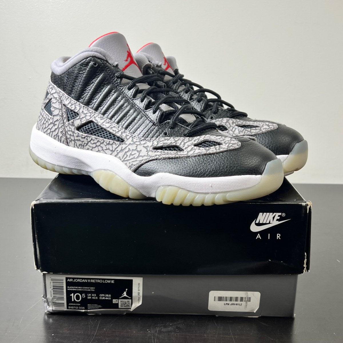 Jordan 11 Retro Low IE Black Cement 10.5 (Lightly Worn Pre-Owned)JordanBlack/Fire Red-Cement Grey-White - Image 1