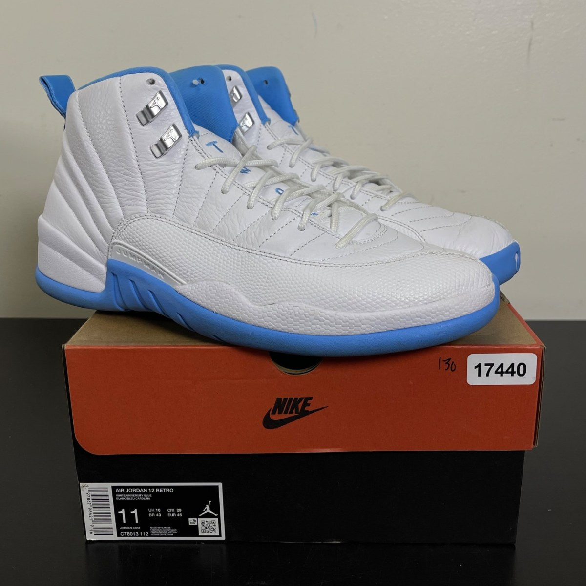 Jordan 12 Retro Melo (2025) 11 (Moderately Worn Pre-Owned)JordanWhite/University Blue/Metallic Silver - Image 1