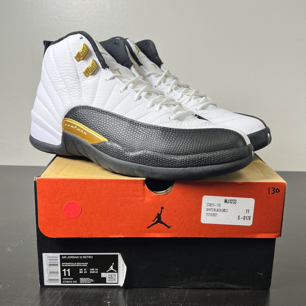 Jordan 12 Retro Royalty Taxi 11 (Lightly Worn Pre-Owned)JordanWhite/Black-Metallic Gold - Image 1