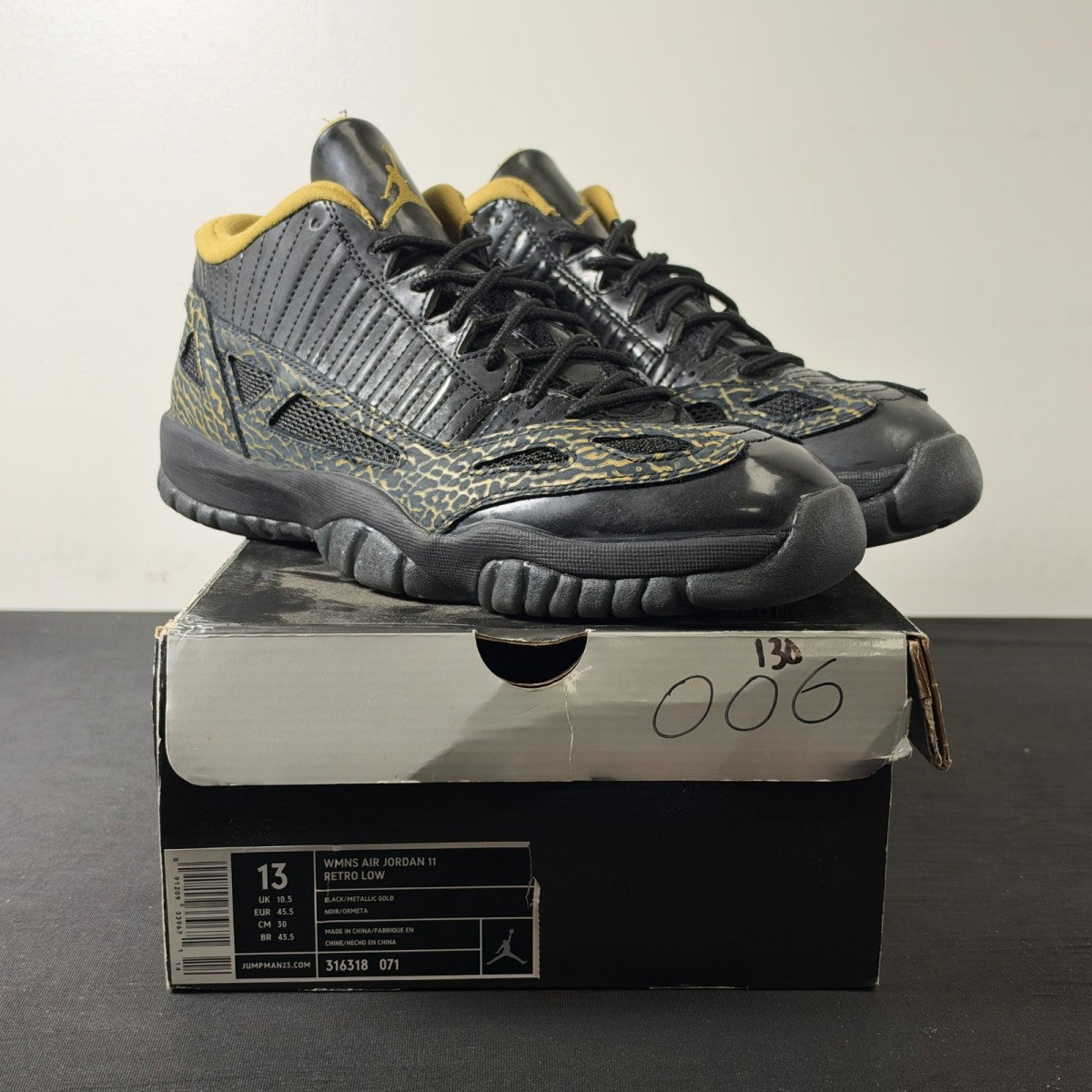 Jordan 11 Retro Low IE Black Metallic Gold (Women's) (Size 13W) - Image 1