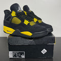 Jordan 4 Retro Thunder (2023) 9.5 (Moderately Worn Pre-Owned)JordanBlack/Tour Yellow - Image 1
