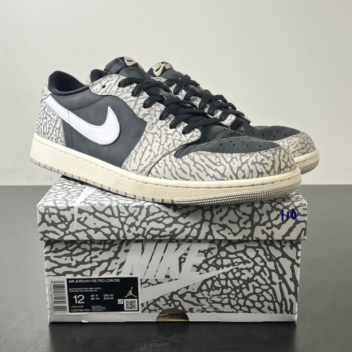 Jordan 1 Retro Low OG Black Cement 12 (Moderately Worn Pre-Owned)JordanBlack/Muslin/Tech Grey/White/Sail - Image 1