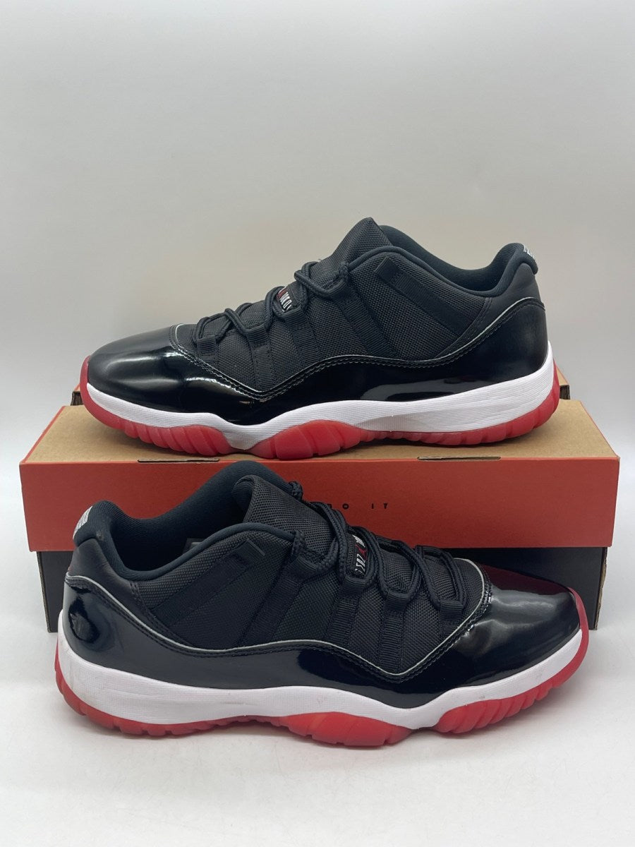 Jordan 11 Retro Low Bred (2025) 11 (Moderately Worn Pre-Owned)JordanBlack/White-Varsity Red - Image 1