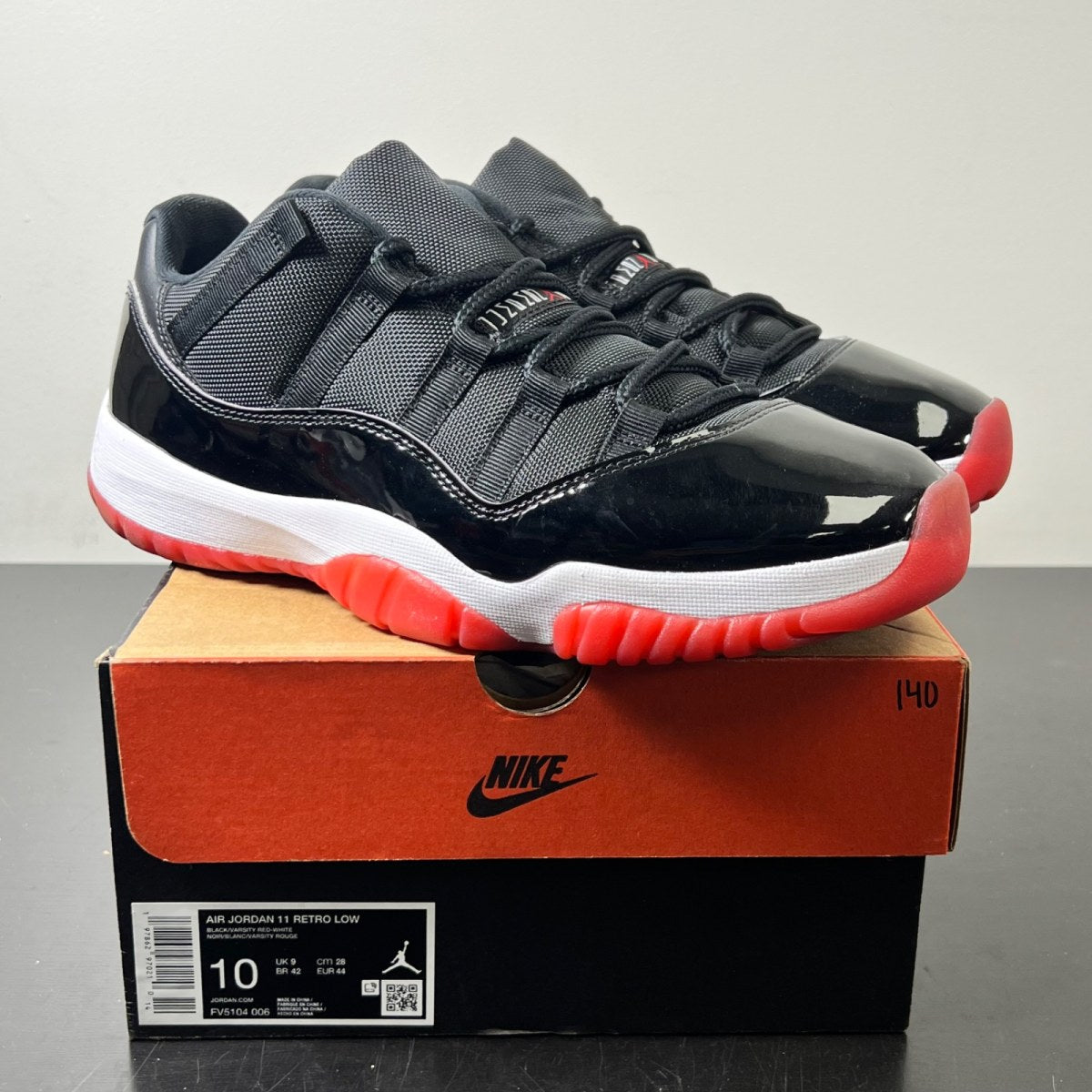 Jordan 11 Retro Low Bred (2025) 10 (Lightly Worn Pre-Owned)JordanBlack/White-Varsity Red - Image 1