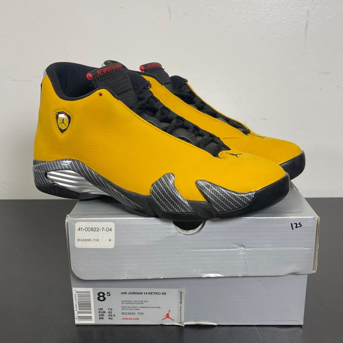 Jordan 14 Retro University Gold 8.5 (Moderately Worn Pre-Owned)JordanUniversity Gold/Black-University Red-Metallic Silver - Image 1