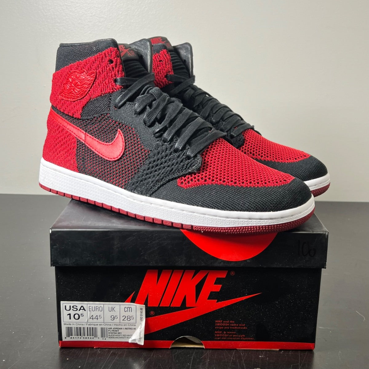 Jordan 1 Retro High Flyknit Bred 10.5 (Lightly Worn Pre-Owned)JordanBlack/Varsity Red-White - Image 1