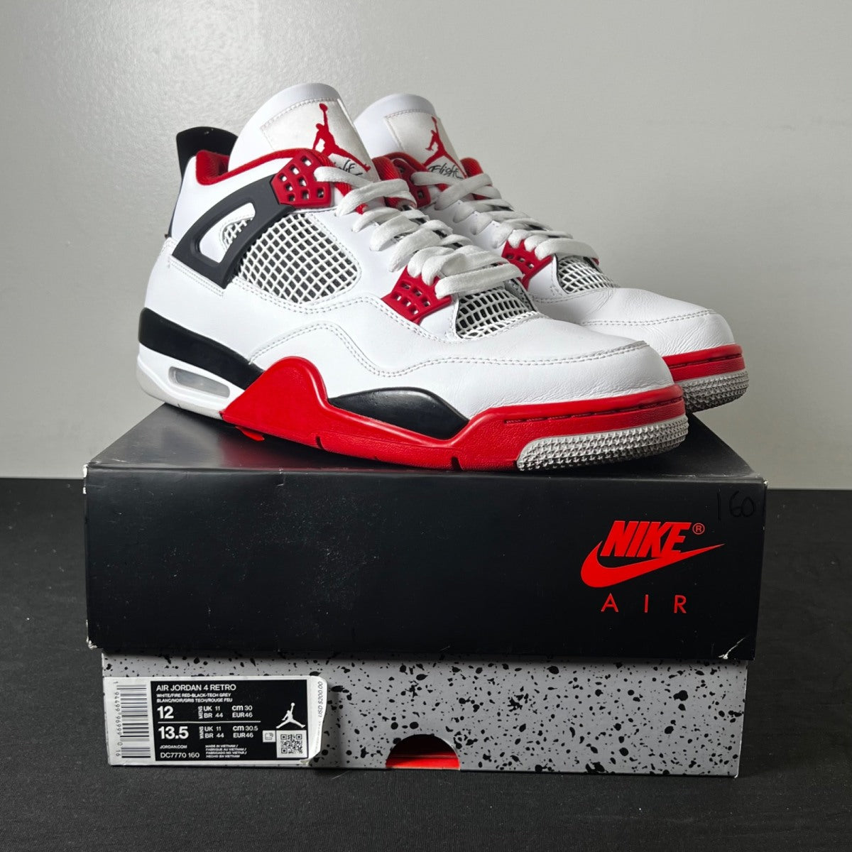 Jordan 4 Retro Fire Red (2020) 12 (Moderately Worn Pre-Owned)JordanWhite/Black-Tech Grey-Fire Red - Image 1