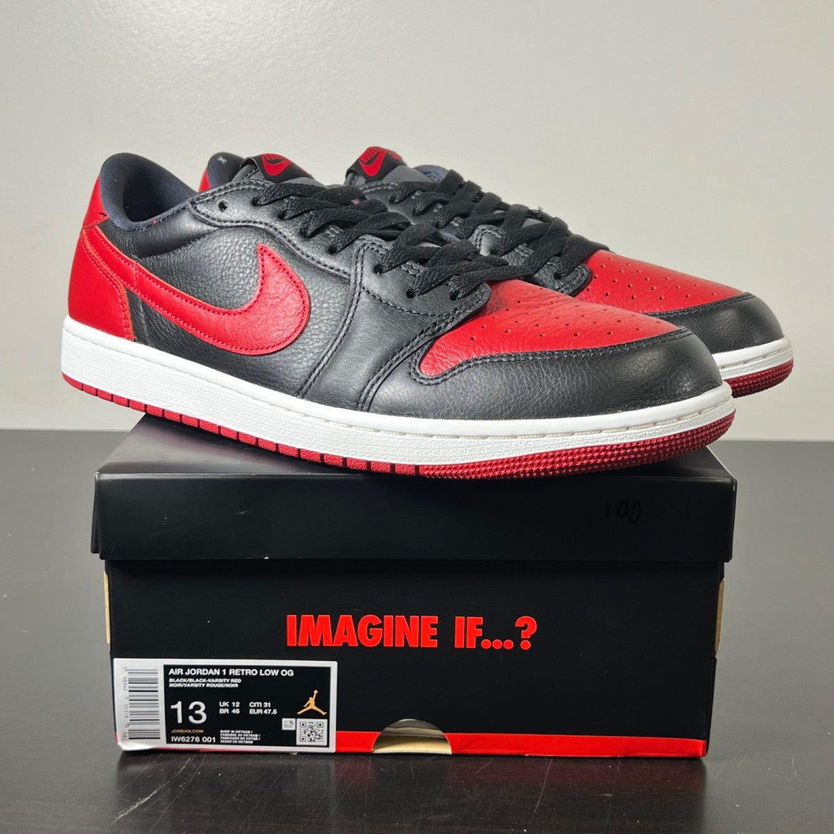 Jordan 1 Retro Low OG Banned 13 (Lightly Worn Pre-Owned)JordanBlack/Black/Varsity Red/Summit White - Image 1